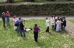students prepare for a scene while others look on