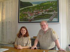 Jessica Lancia assists volunteer Chris Suiter at the Information Desk.