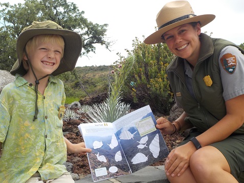 Eliot shows Ranger Katelyn his favorite activity in the book,