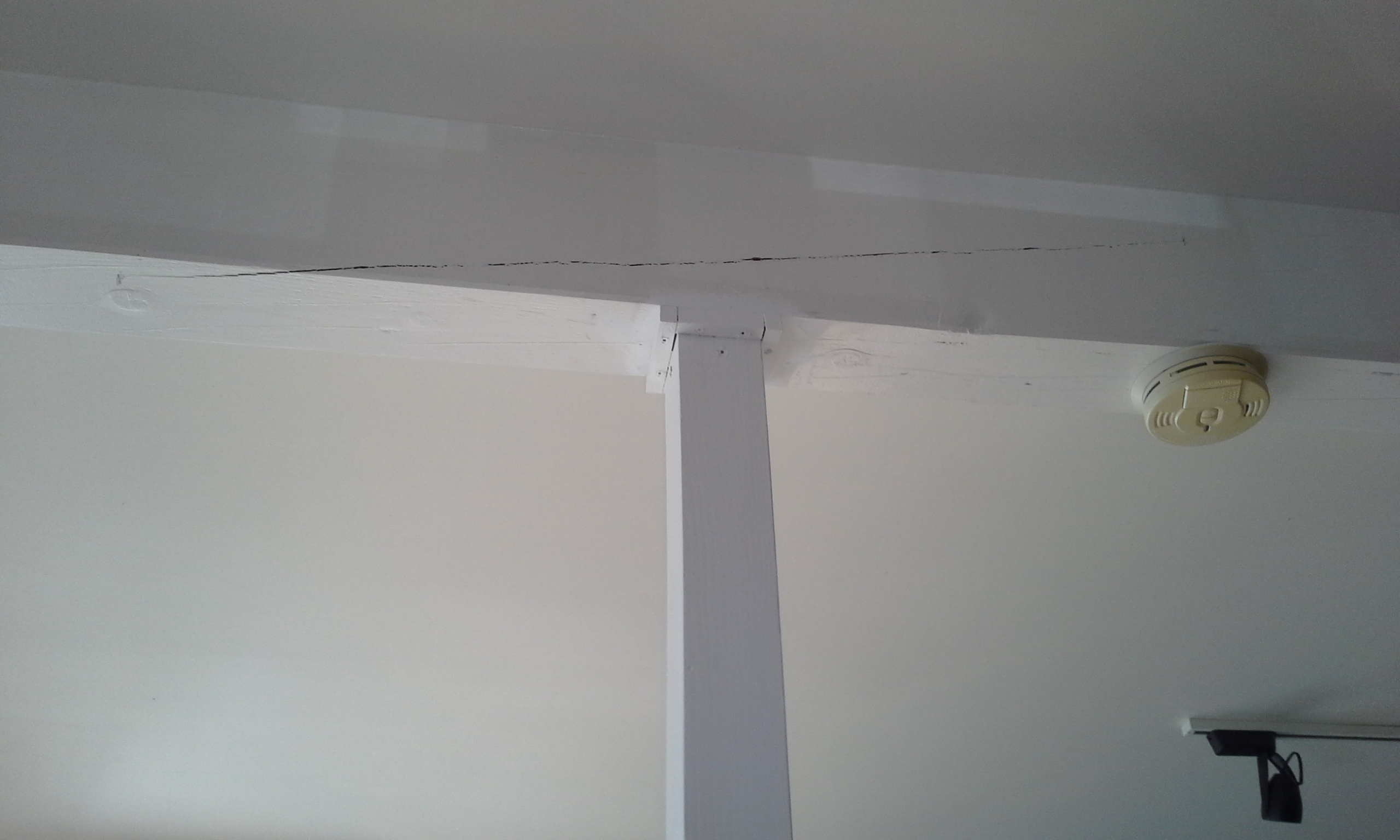 pole and ceiling beam crack