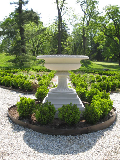 Reproduction urn placed in historic falling garden at Hampton NHS.