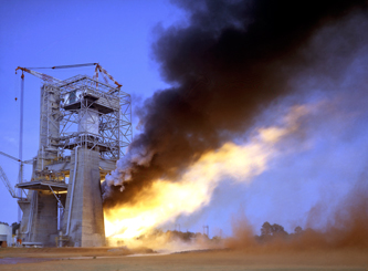 The Saturn V S-1C stage being test fired in its test stand at Marshall Space Flight Center. Note the massive concrete piers and the robust steel framing needed to resist the force of the powerful rocket engines. Photo courtesy of NASA, Marshall Space Flight Center.
