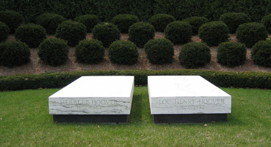Two white marble slabs mark the graves of Herbert and Lou Henry Hoover.