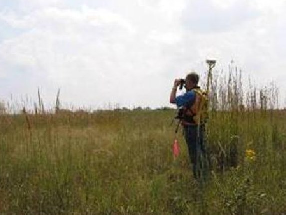 An ornithologist from NPS Heartland Network inventories grassland bird species.