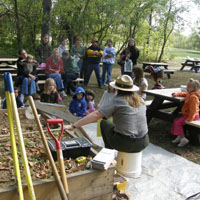 Kids learn about archeological excavation techniques during a mock dig.