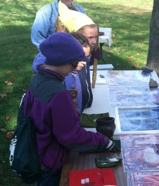 Kids discovering Hopewell artifacts during Hopewell Discovery Day.