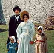A family dressed in the finest 1830 attire.
