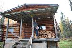 Last Homesteader in front of his cabin