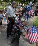 Man with bicycle fastened to it