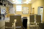 Room with exhibit cabinets and timeline on wall
