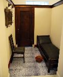 Small room with Mission oak cot and chair