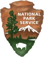 National Park Service symbol with an arrowhead shape with mountains, water, and a bison inside