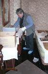 Curator packs Truman artifacts for storage.