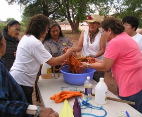 Participants working with wool that has been dyed.