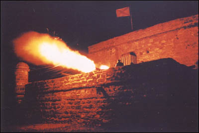 Fort Matanzas firing a cannon at night