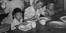 Dining in the mess hall. Photo by Dorothea Lange.