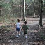 Two children walking trail