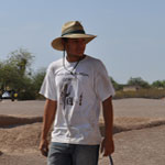 YCC worker in tan Youth Conservation Corp t-shirt and straw hat