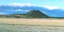 Color photograph showing Capulin Volcano in the distance Color photograph showing Capulin Volcano in the distance