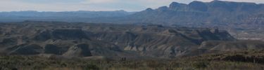 The view from the Mesa de Anguila dwarfs two hikers