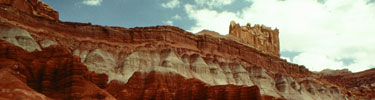 The Wingate Sandstone Castle is perched on the banded Chinle formation