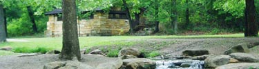 Stone building and stream in Flower Park