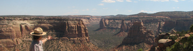 Interpretive ranger showing others the view