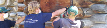 Youth Conservation Corps interns work on a WCHP building