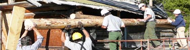 WCHP staff repairs the roof of a historic building