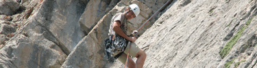 Climbing school student rappelling