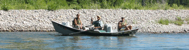 Visitors on a guided fly fishing trip on the Snake River