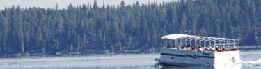 Concessioner-operated boat travels across Jenny Lake