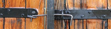 The door handles, like the building itself have weathered the elements of time.
