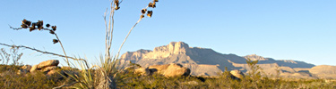 The distant Guadalupes rise abruptly from the desert floor below.
