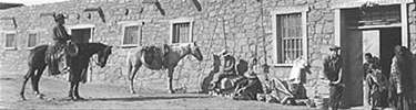 Horse riders in front of Hubbell Trading Post.