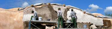 Lime plastering the granary