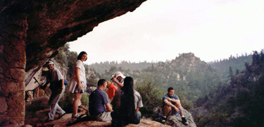 Visitors at a Walnut Canyon dwelling