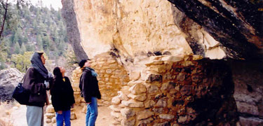 Visitors admire an Island Trail dwelling