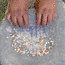 Corn being ground on a metate