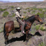Park volunteer riding a horse patrol