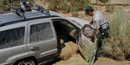 Don’t let this happen to you!  Check area forecasts! Vehicle being inspected by park rangers following a flash flood