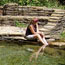 Woman putting her feet in the water of Buffalo Springs