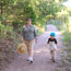 Woman with a young boy hiking along a trail