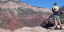 Picture of lone hiker looking across canyon.