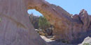 A natural arch is carved out of the cliffs of Sandstone Bluffs