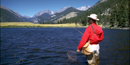 a photo of a fisherman in a lake