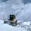 a photo of a plow clearing Trail Ridge Road of snow a photo of a plow clearing Trail Ridge Road of snow