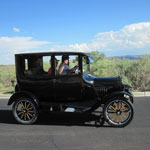 A Model T takes park visitors to a trailhead.