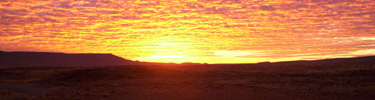 The sun rises over El Malpais