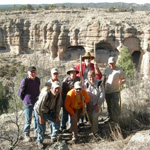 Volunteer interpretive park rangers pose for a photo while exploring Gila Cliff Dwellings National Monument.